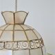 Mother-of-pearl and brass suspension