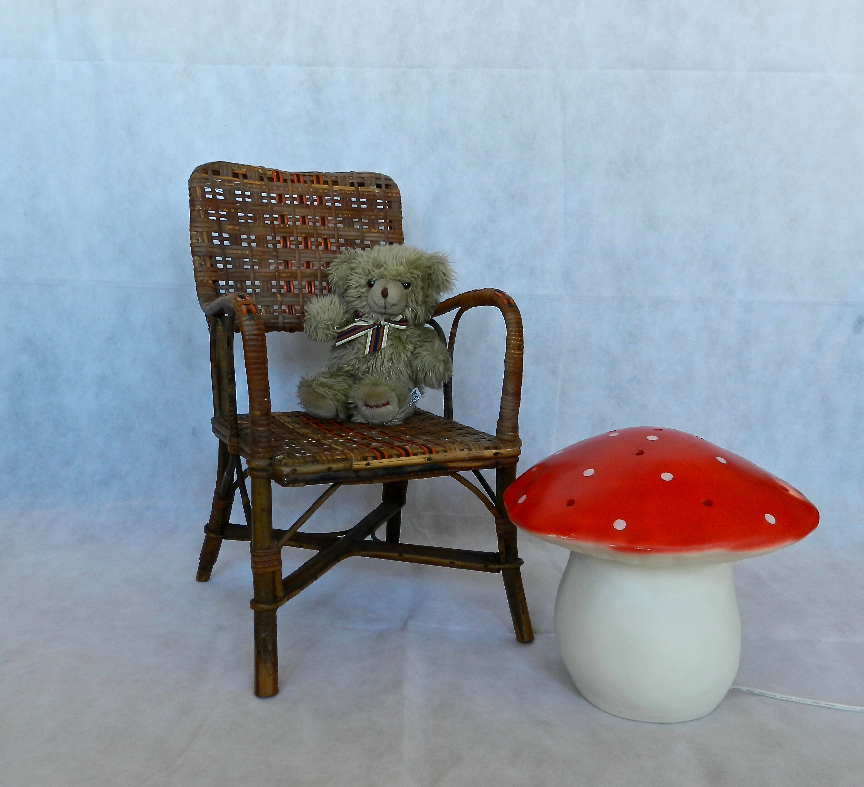 Small child vintage armchair in rattan
