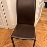 Many brown leather chairs "Roche Bobois"