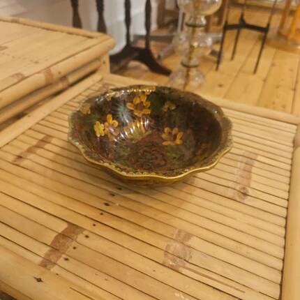 Vintage Asian brass bowl with floral decoration.