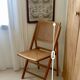 Folding wooden and cane chair