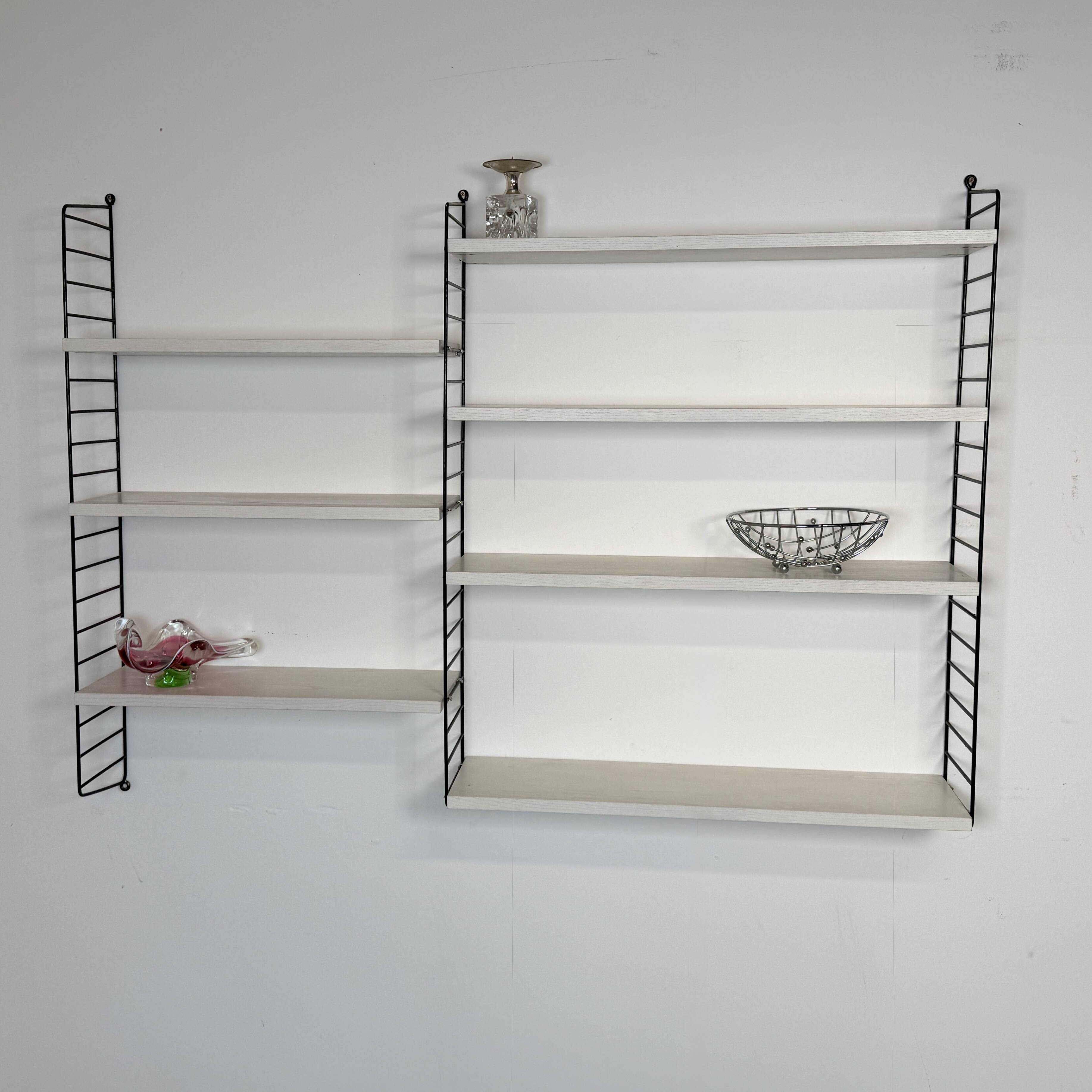 Vintage Nisse Strinning wall rack with 7 white shelves