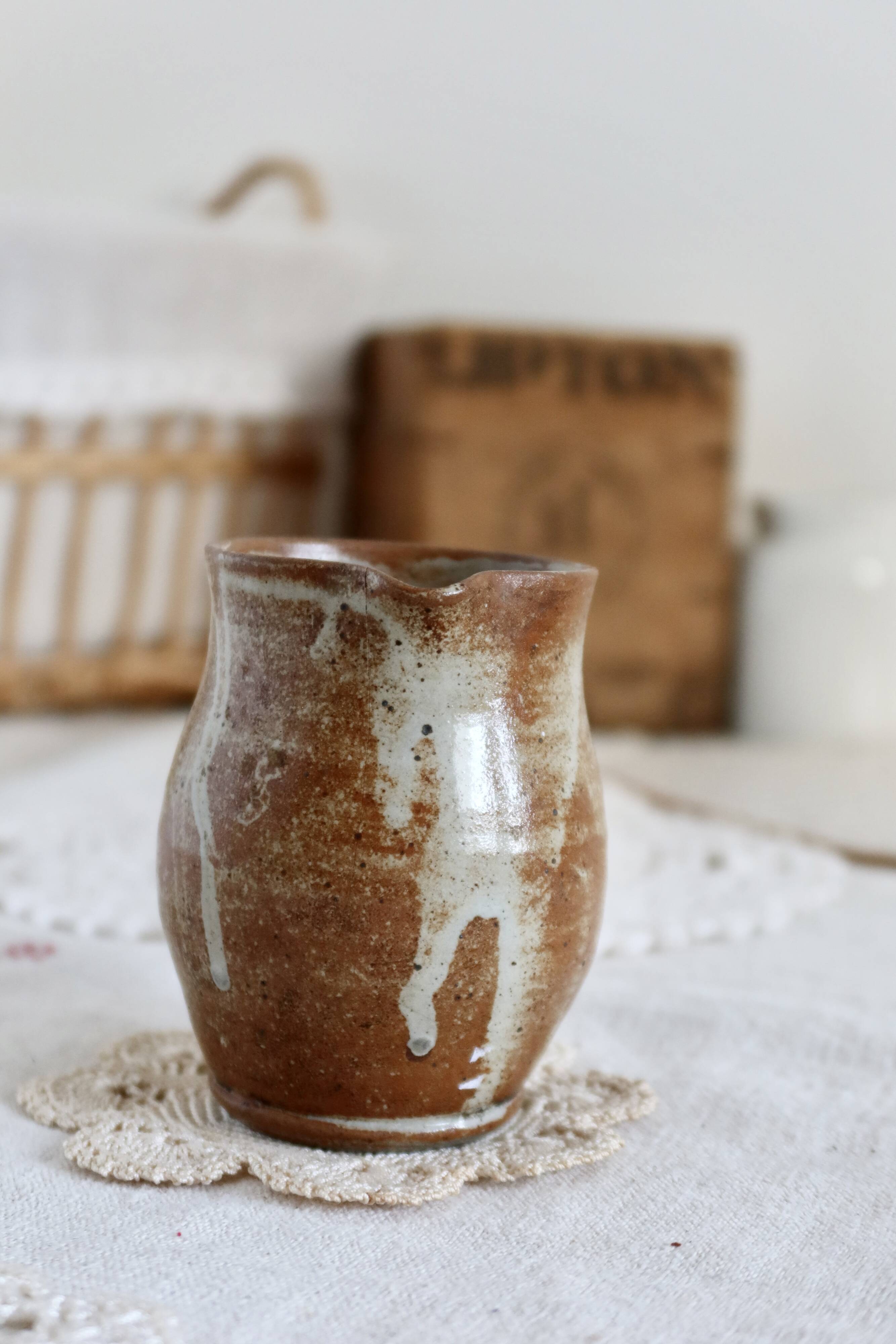 Small vintage hand turned ceramic milk jug with rustic glaze