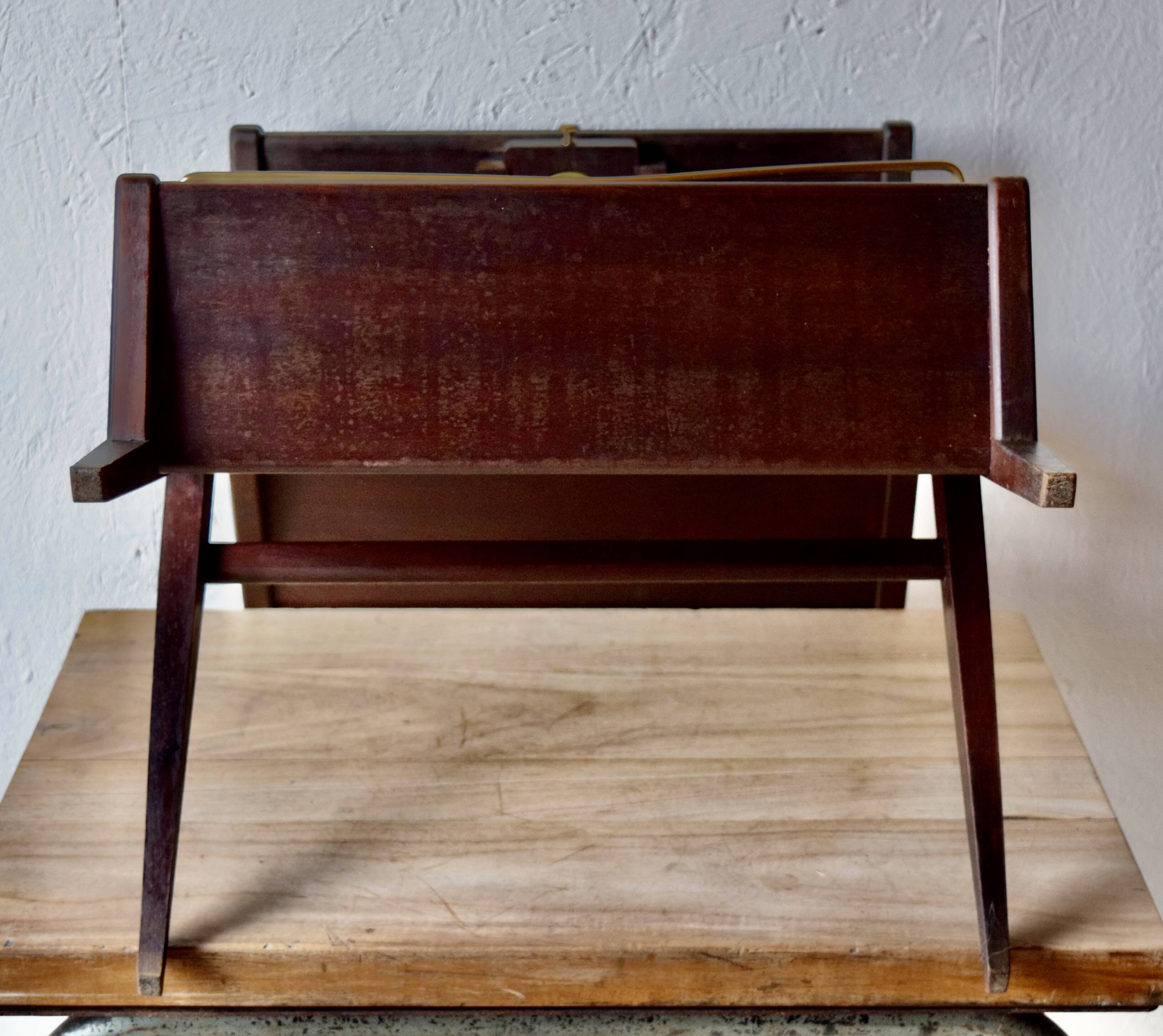 Old Scandinavian style magazine rack in dark wood with integrated brass ashtray