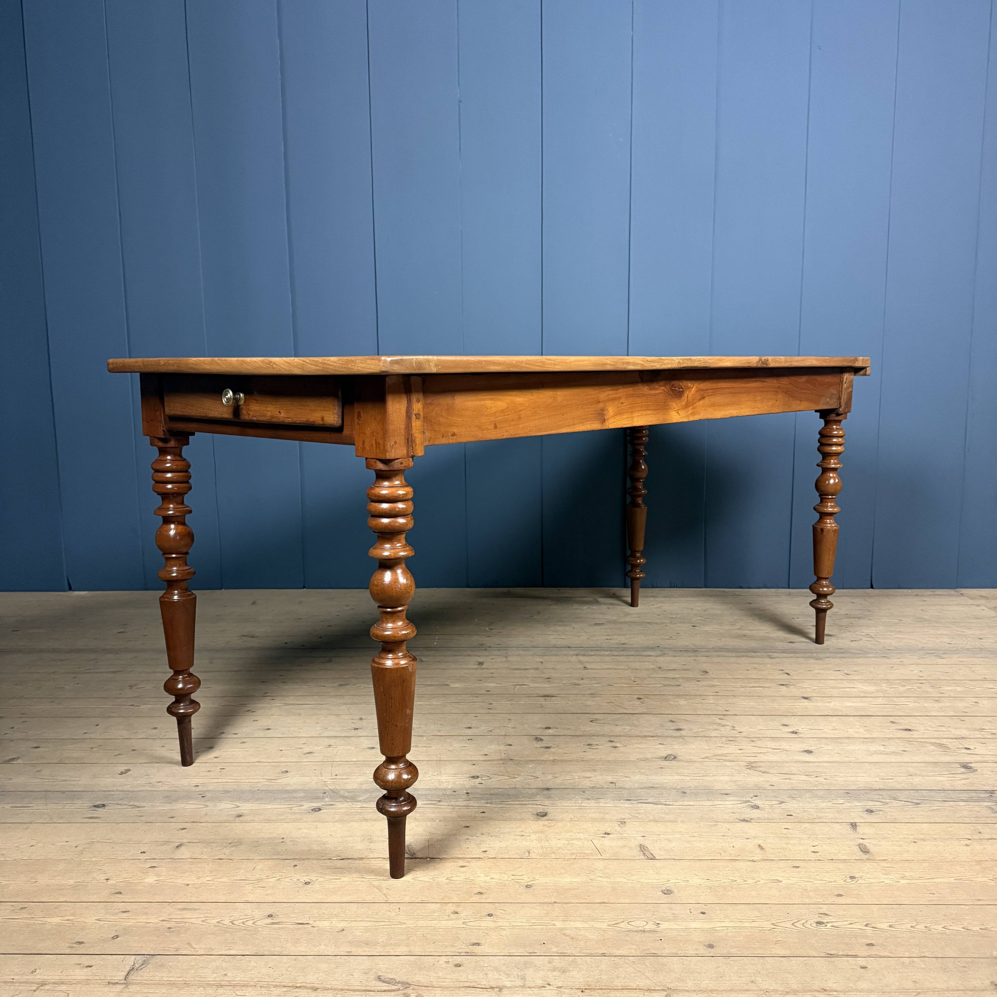 Antique cherry wood dining table from France.
