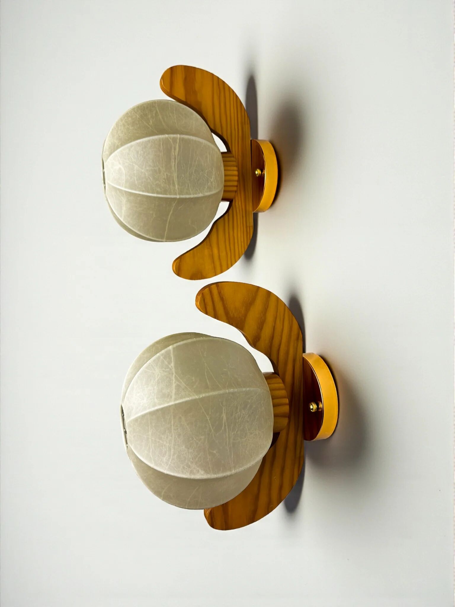 Pair of Italian "Cocoon" wall lights, resin and pine wood, circa 1970