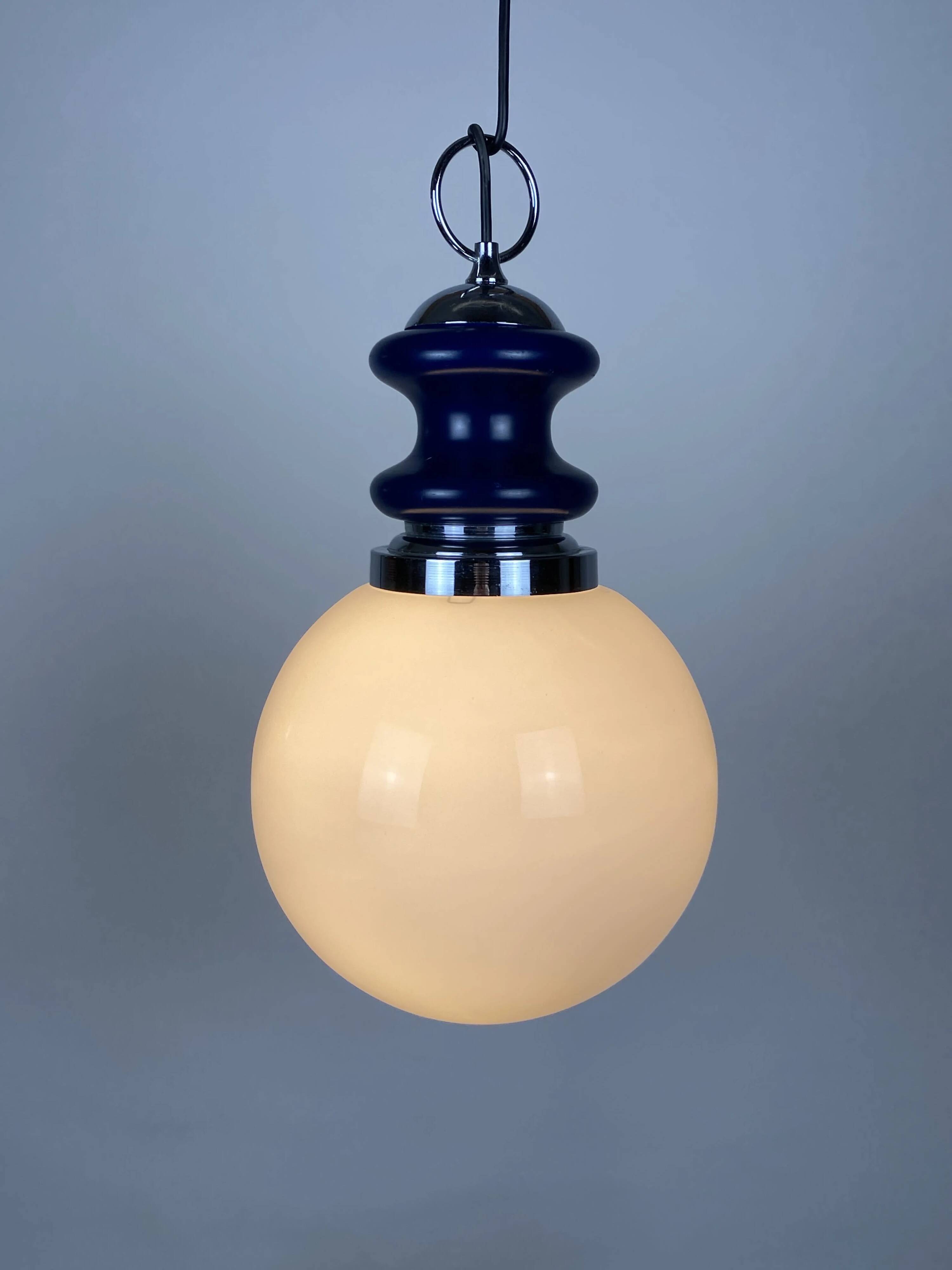 Vintage glass sphere with blue metal pendant from the 1970s.