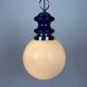 Vintage glass sphere with blue metal pendant from the 1970s.