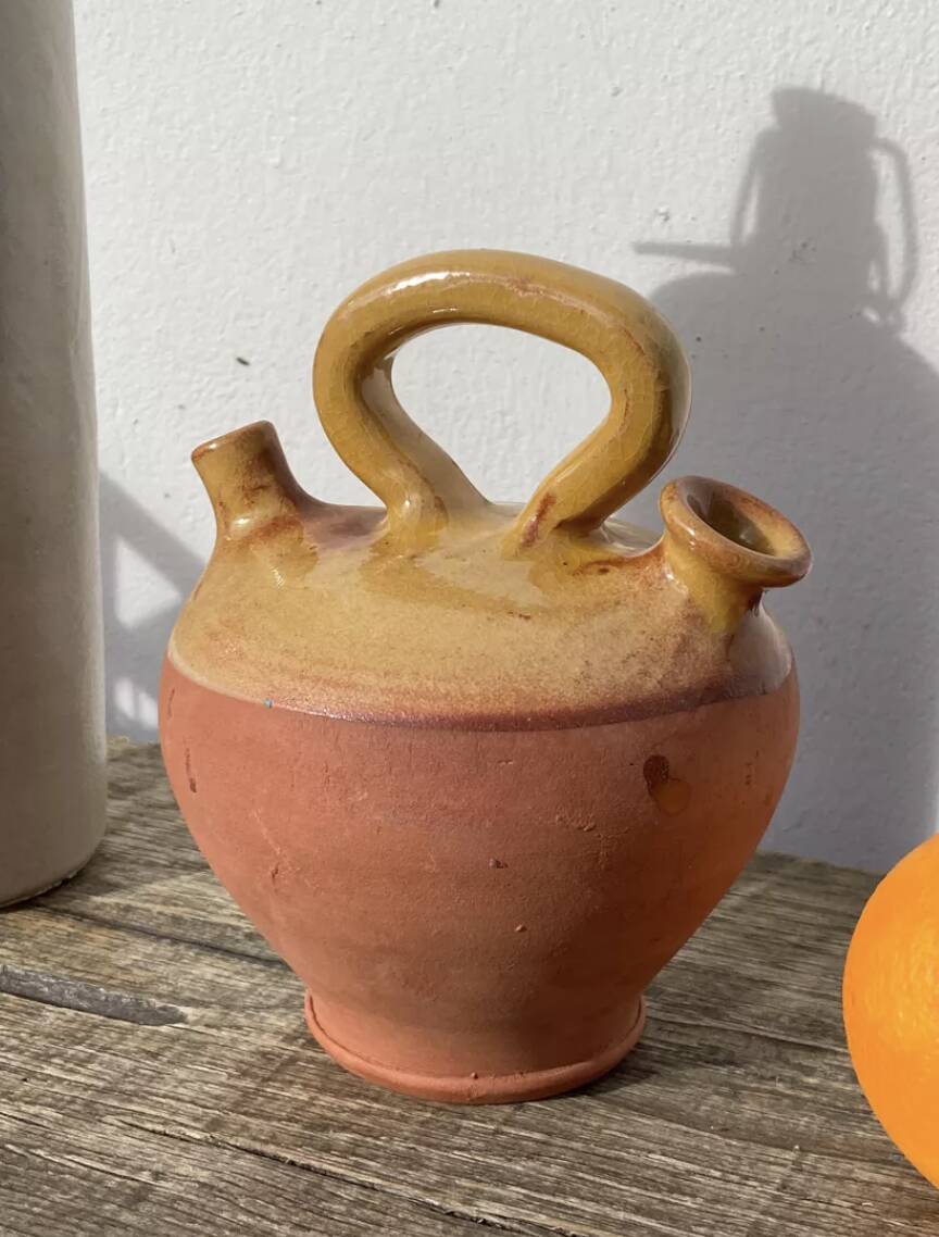 Gargoulette or old jug in yellow glazed terracotta