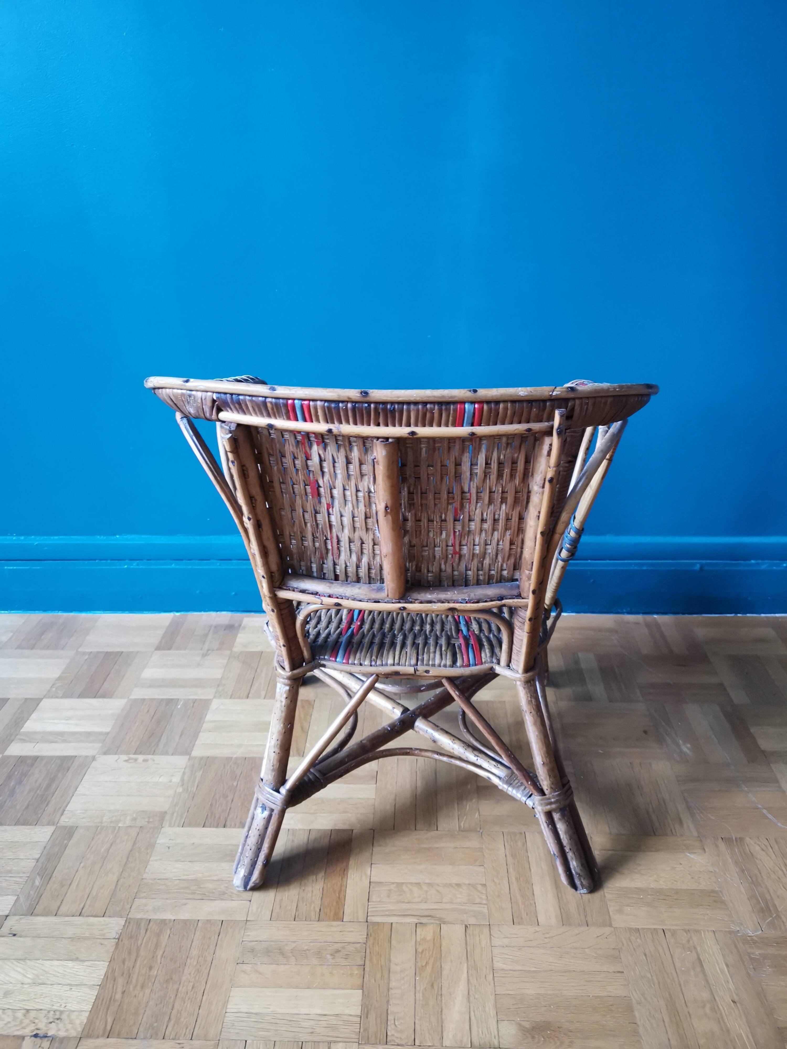 Small child vintage armchair in rattan