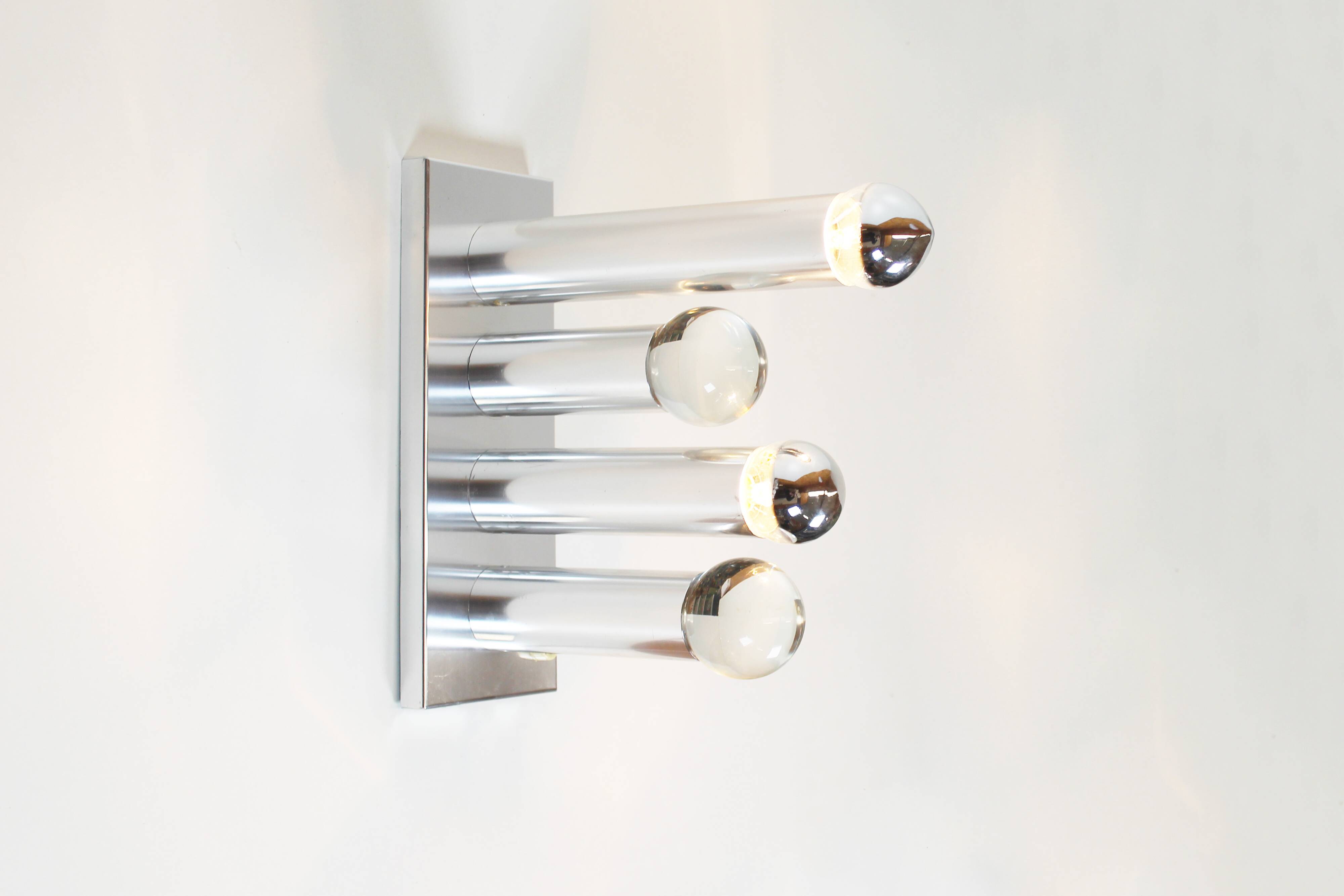 Pair of polished wall lamps by Gaetano Sciolari
