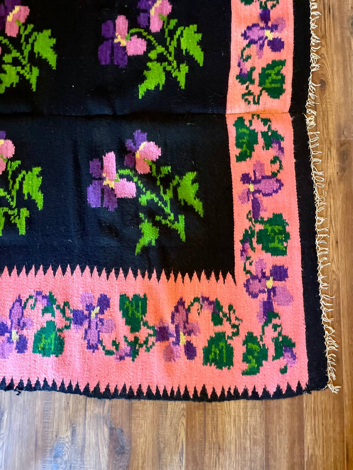 Oltenian floral rug handwoven in wool, purple flowers on black and pink background