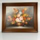Vintage decorative table featuring a floral still life, signed Frederik.