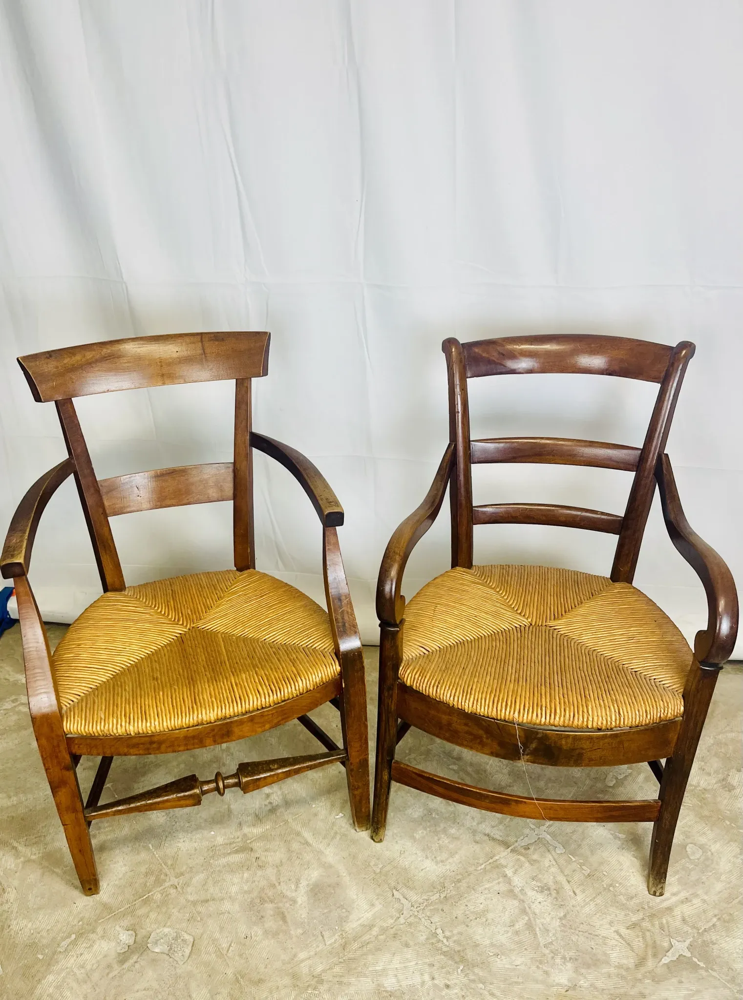 Pair of dissimilar walnut armchairs