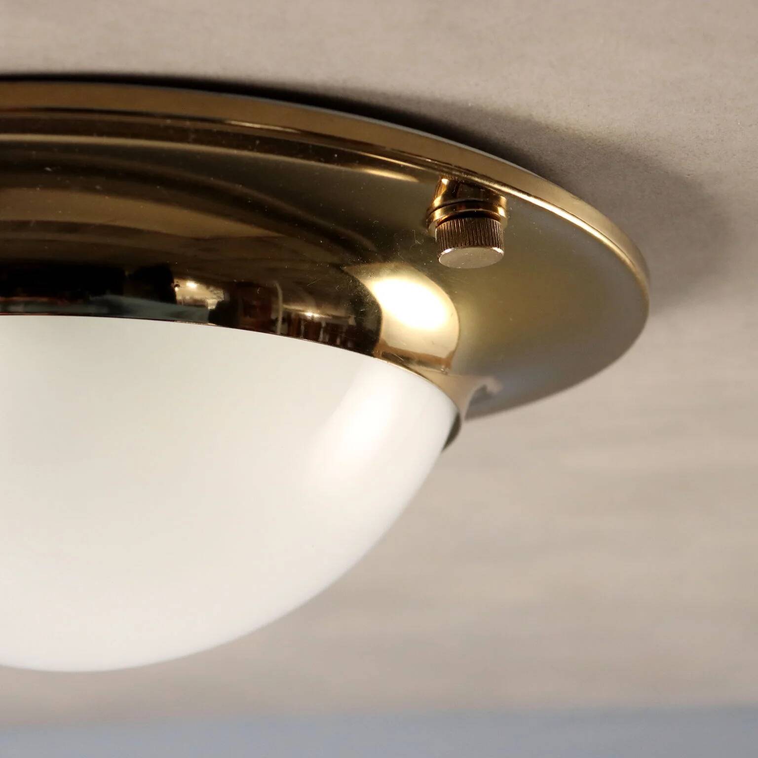 Vintage wall light in aluminium, brass, and glass, 1970s design.