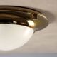 Vintage wall light in aluminium, brass, and glass, 1970s design.