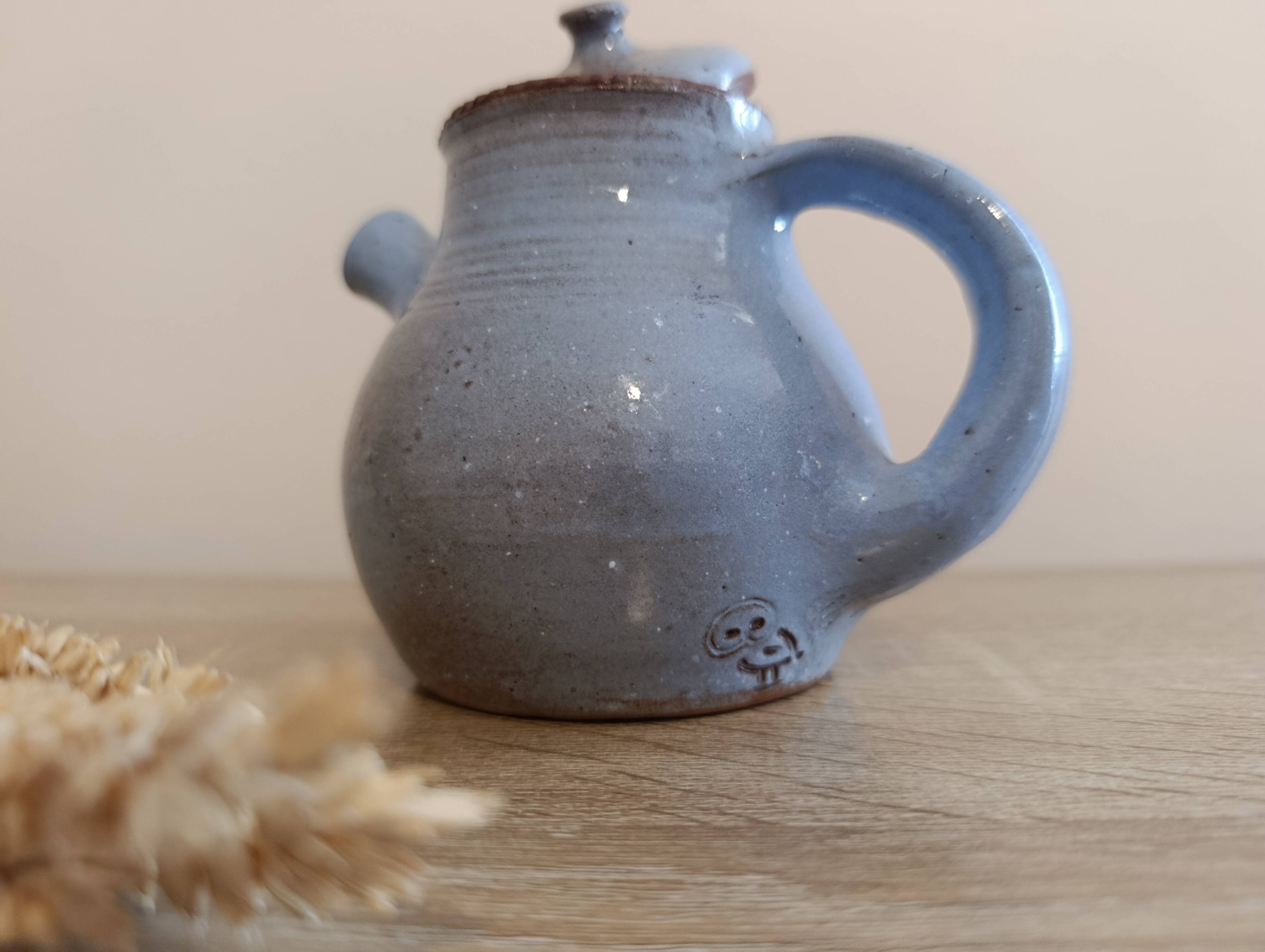 Ceramic teapot in blue/grey glaze, signed by Jeanne and Norbert Pierlot.
