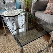 Chrome and smoked glass coffee table on wheels 1970