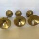 Trio of brass tulip foot candle holders