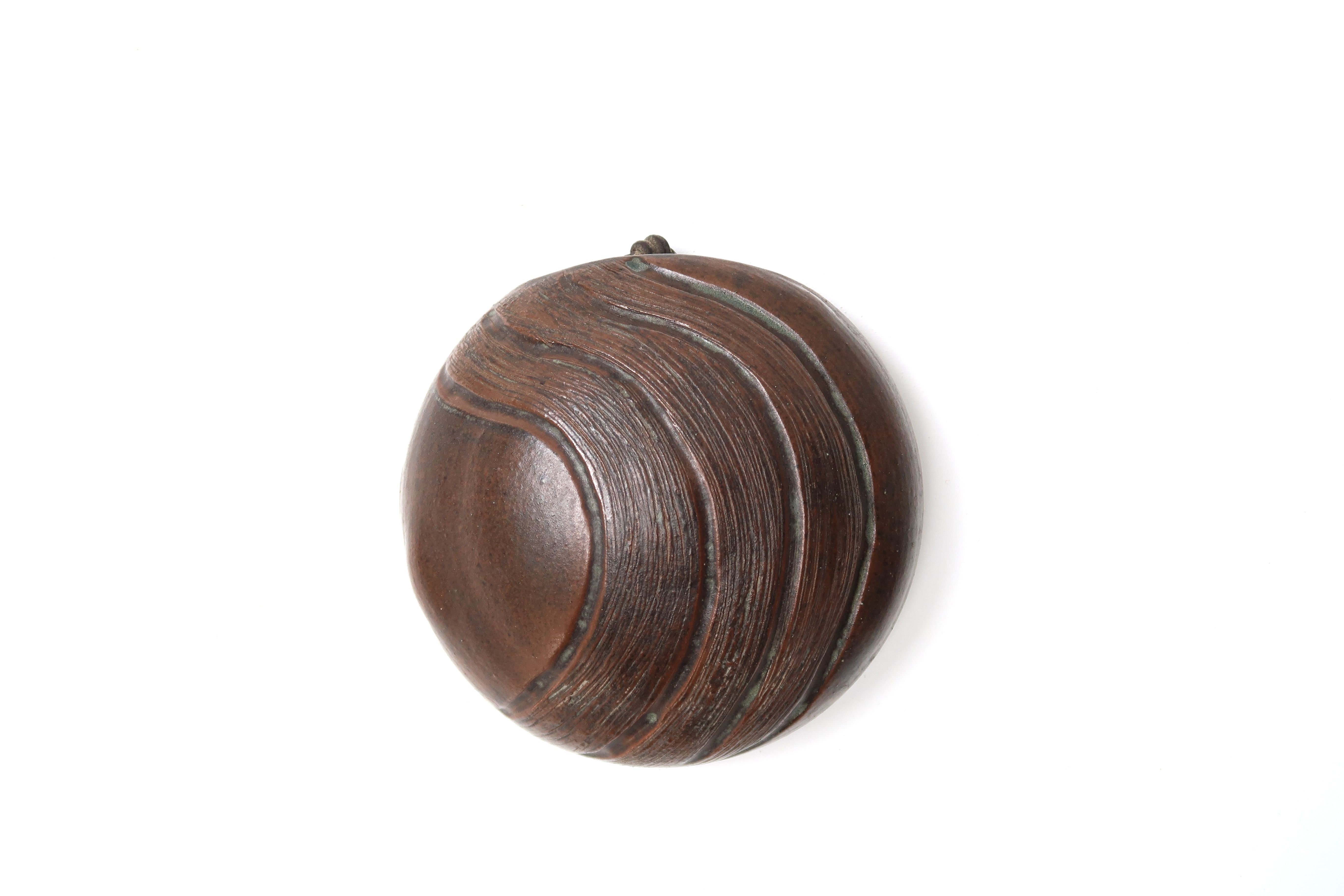 Ceramic "lens" wall vase signed Ama, 50s