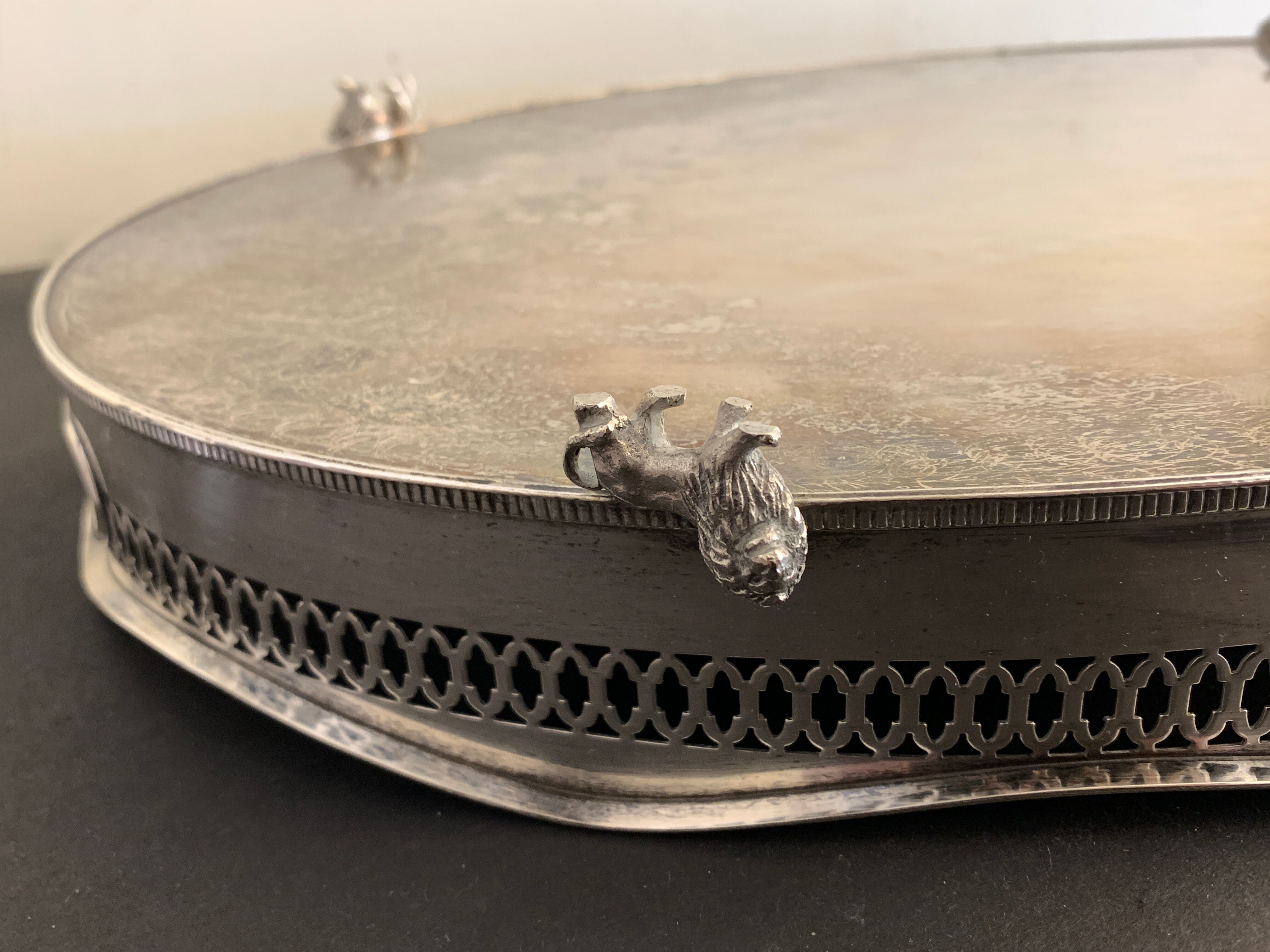 Alpaca silver metal to  lion feet and openwork borders