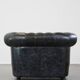 Spacious black cow leather chesterfield armchair with distinctive character