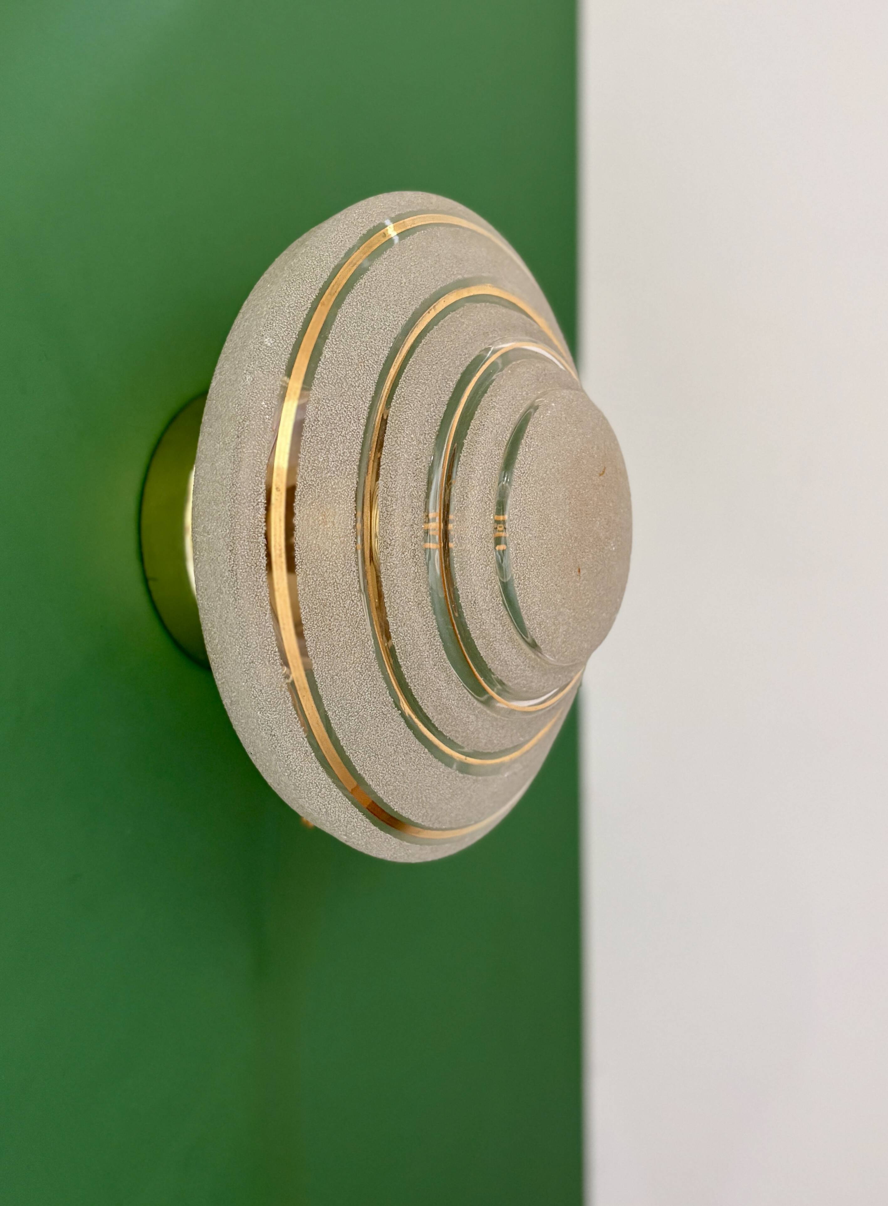 Old glass globe wall/ceiling light in frosted white and gold.