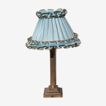 Brass lamp with vintage blue laminated lampshade