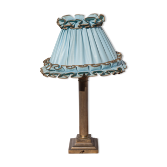 Brass lamp with vintage blue laminated lampshade