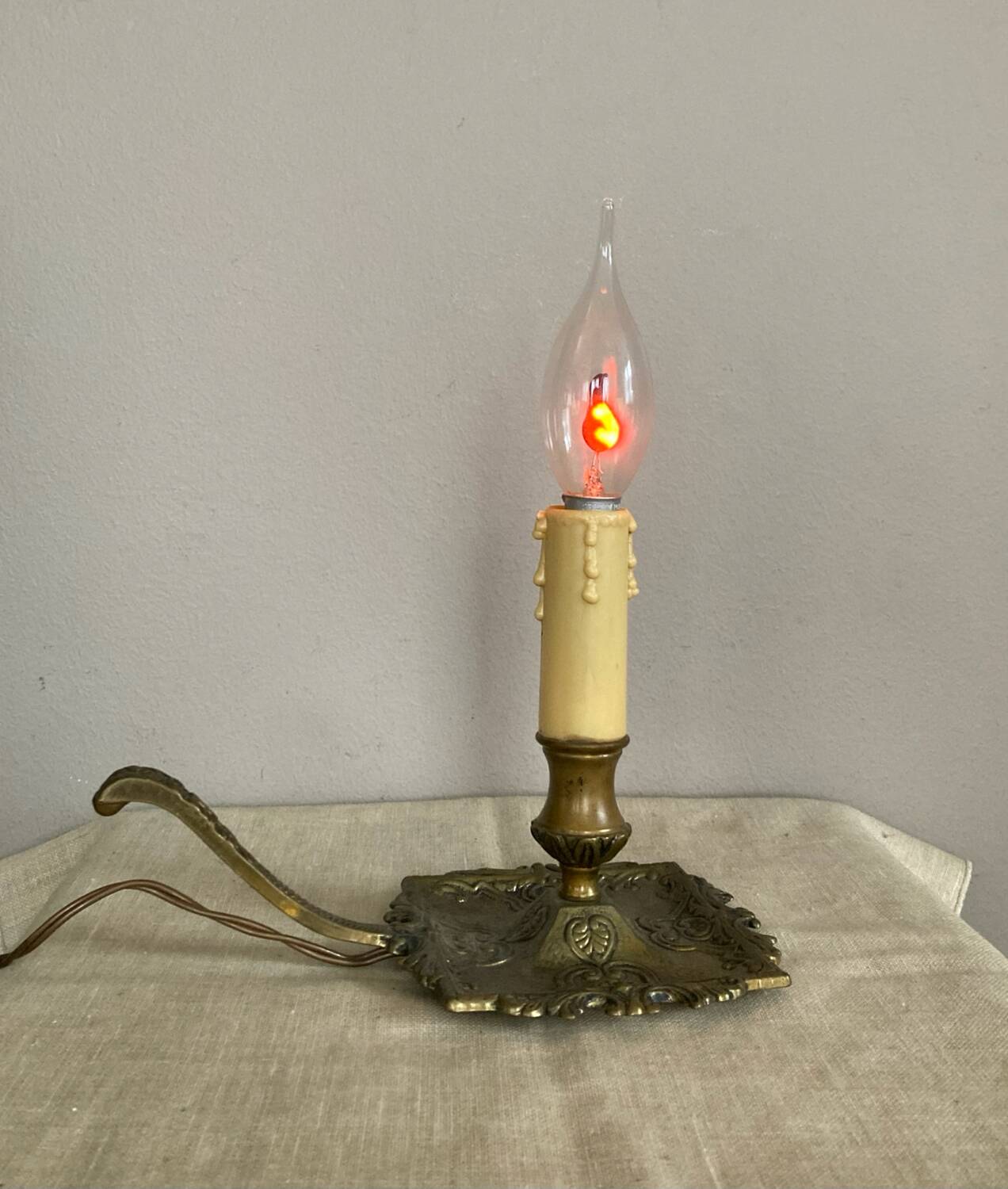Candle holder with 20th century spelter socket mounted as a flame bulb lamp