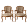Pair of Louis XV/XVI armchairs in carved wood and floral fabric.
