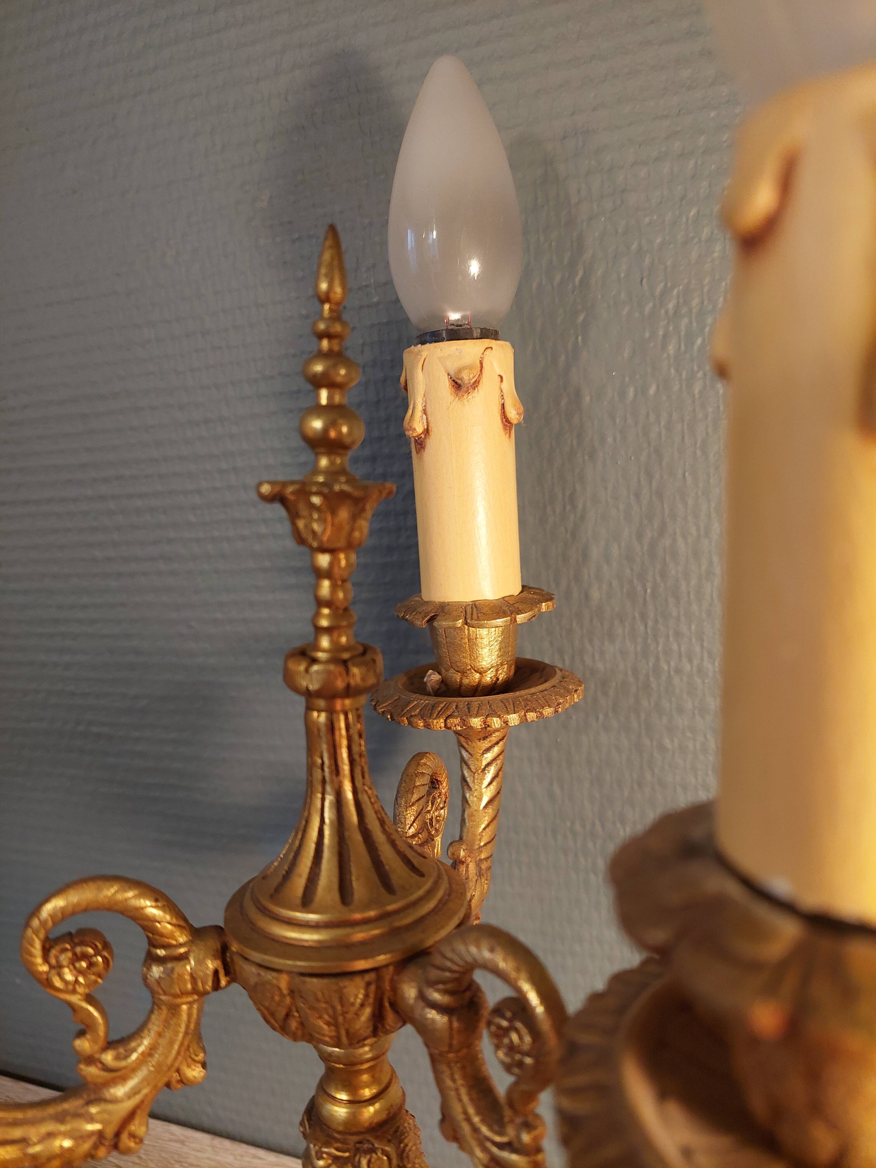 Electrified three-spoke brass candlesticks
