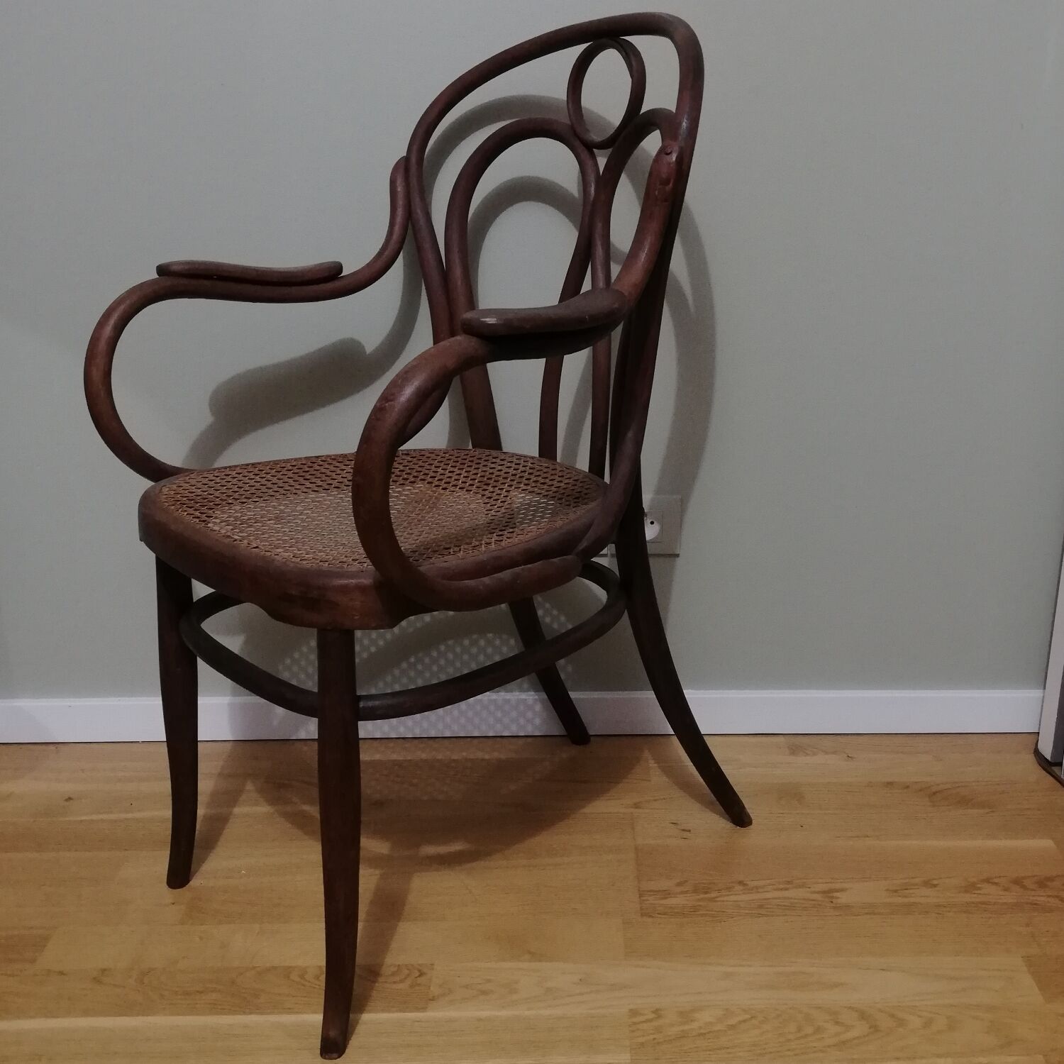 Canned armchair in curved wood signed J.Kohn