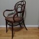 Canned armchair in curved wood signed J.Kohn