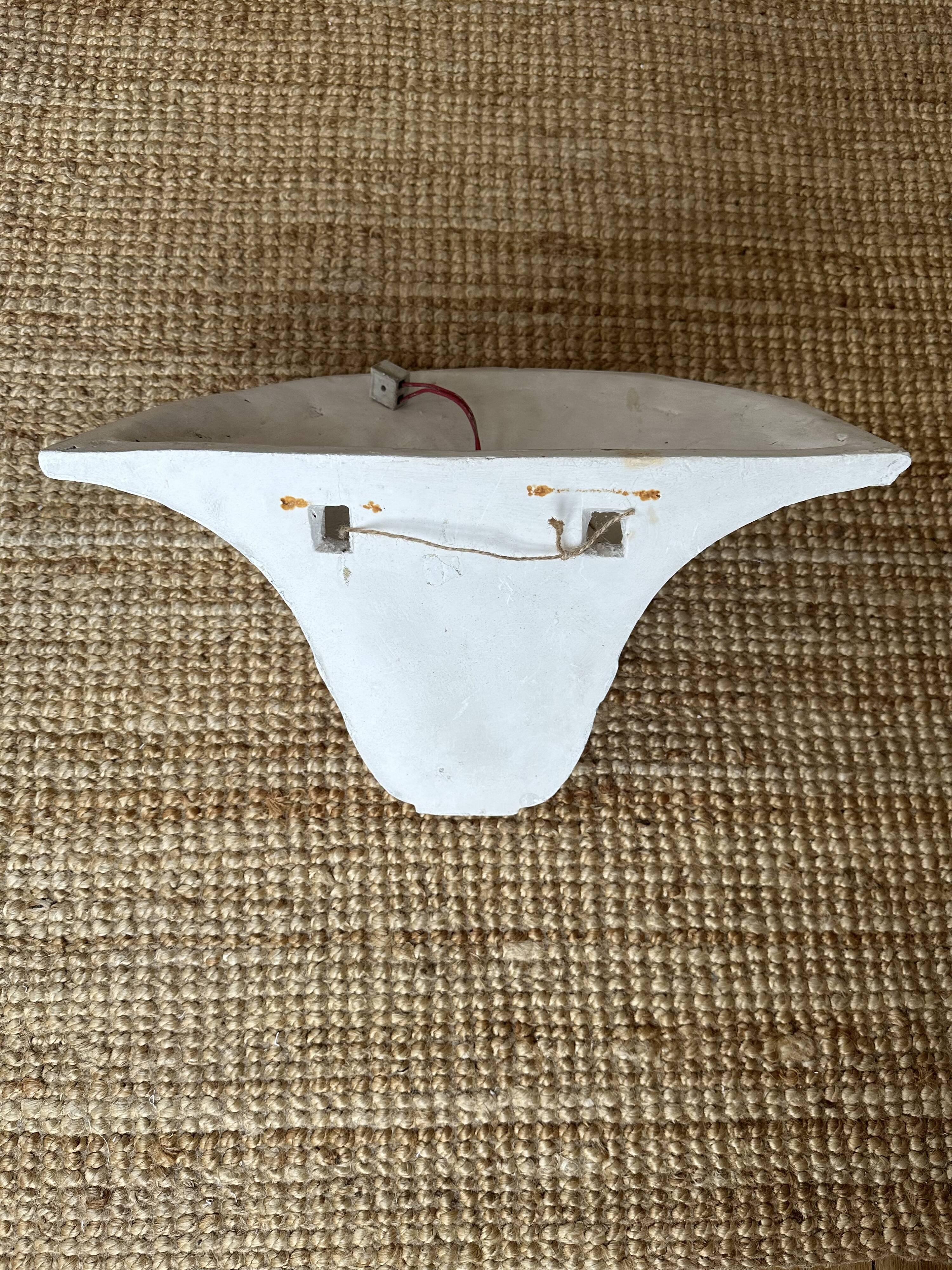 Pair of plaster wall sconces, palmette decoration, 20th century