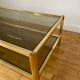 Gold metal coffee table and smoked glass