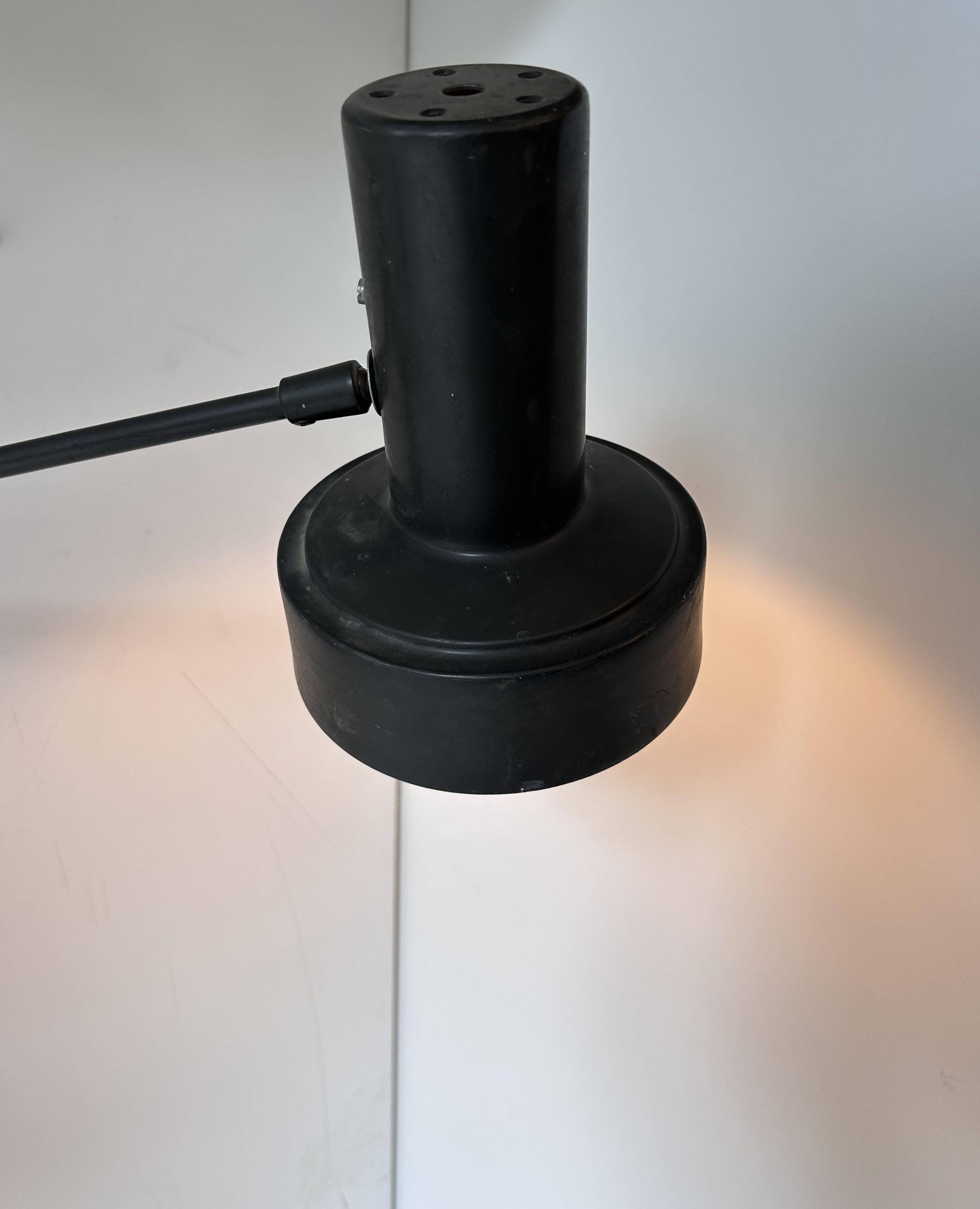 Pair of vintage adjustable wall lights, matte black metal, France 1960s