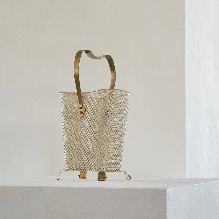 Mid-century umbrella stand in patinated brass and perforated metal, 1950s.