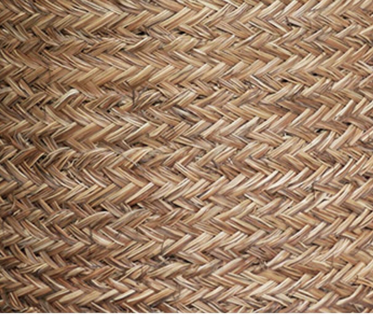 Hand-woven laundry basket in natural rush