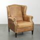 Comfortable cowhide wingback armchair with a timeless English look