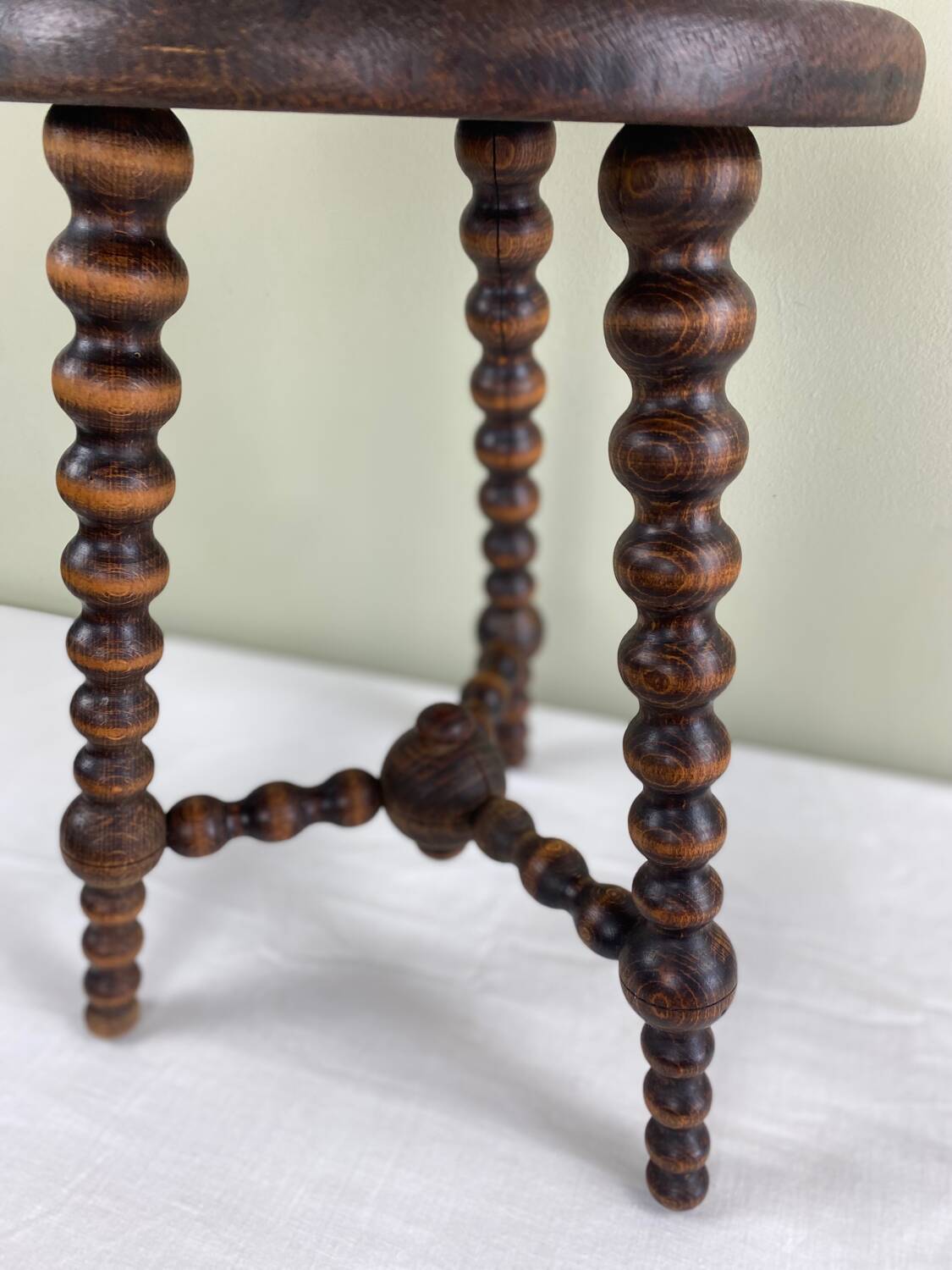 Signed turned wood tripod stool