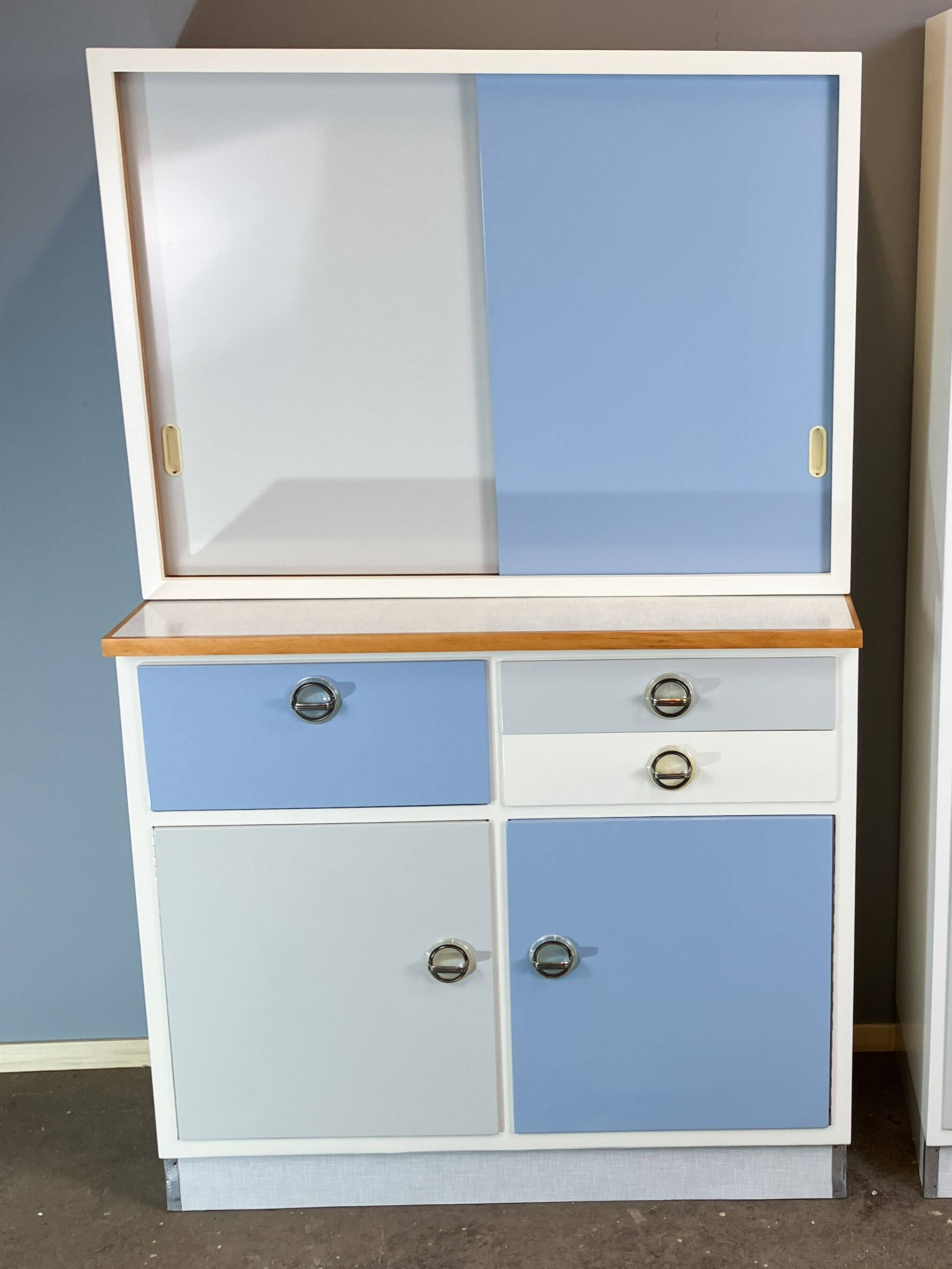 Kitchen cabinets, pastel blue and light gray, vintage from the 60s