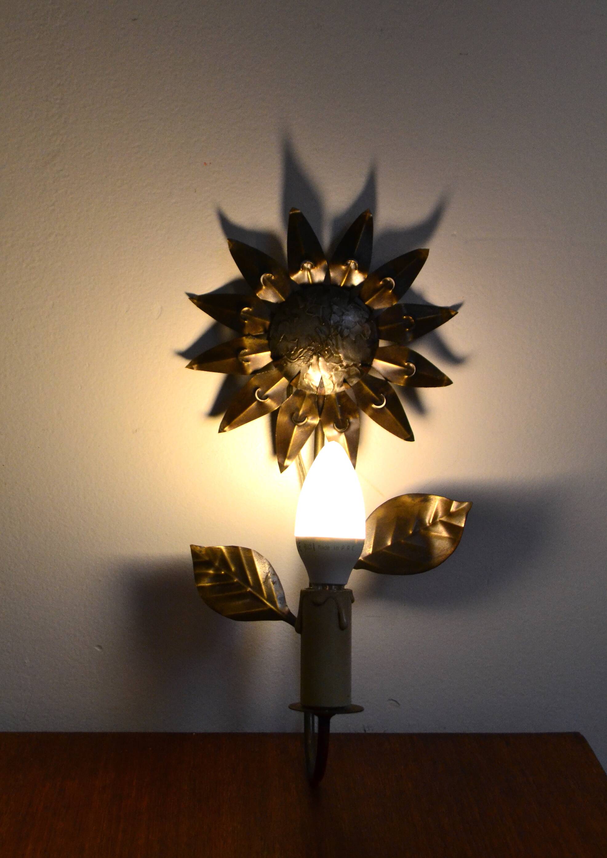 Brass flower wall light from the 1970s.