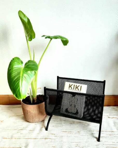 Cast iron magazine rack, circa 1950