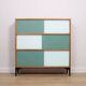 A vintage mid-century 3 tiered bookcase with glass sliding doors
