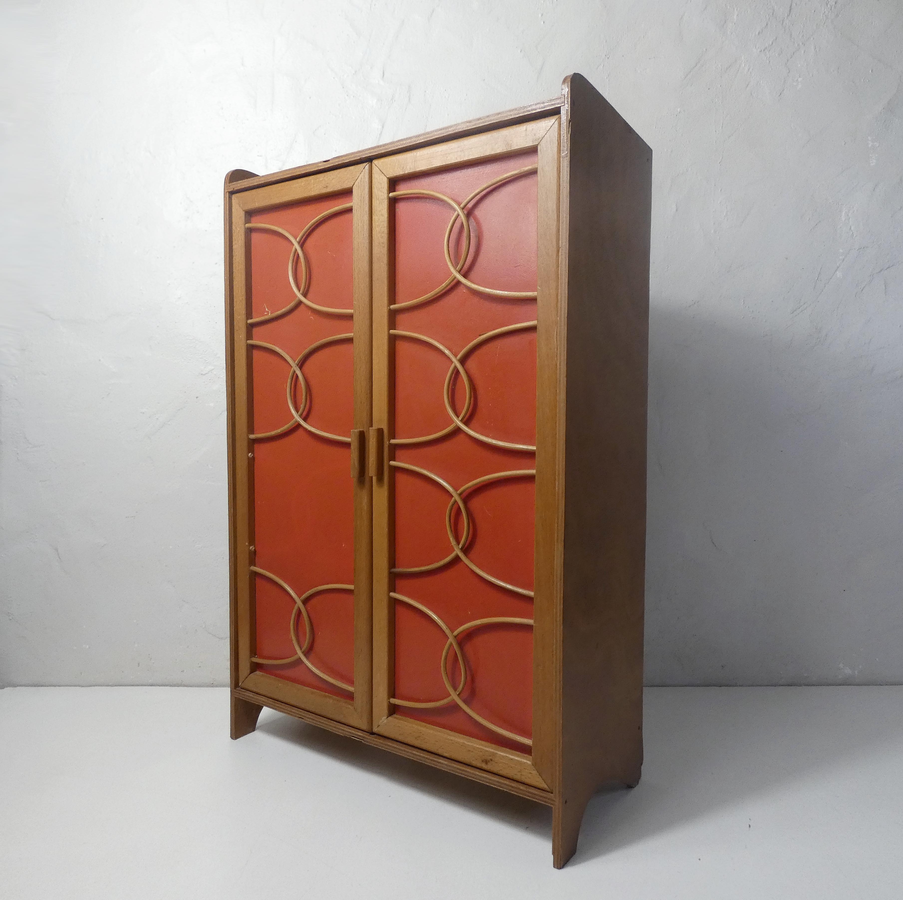 Rattan doll cabinet
