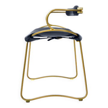 Contemporary kitchen bar stool with brass metal backrest and navy blue leather.