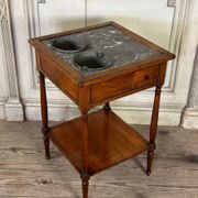 Refreshment table in mahogany, grey marble top, two zinc buckets, 18th century.