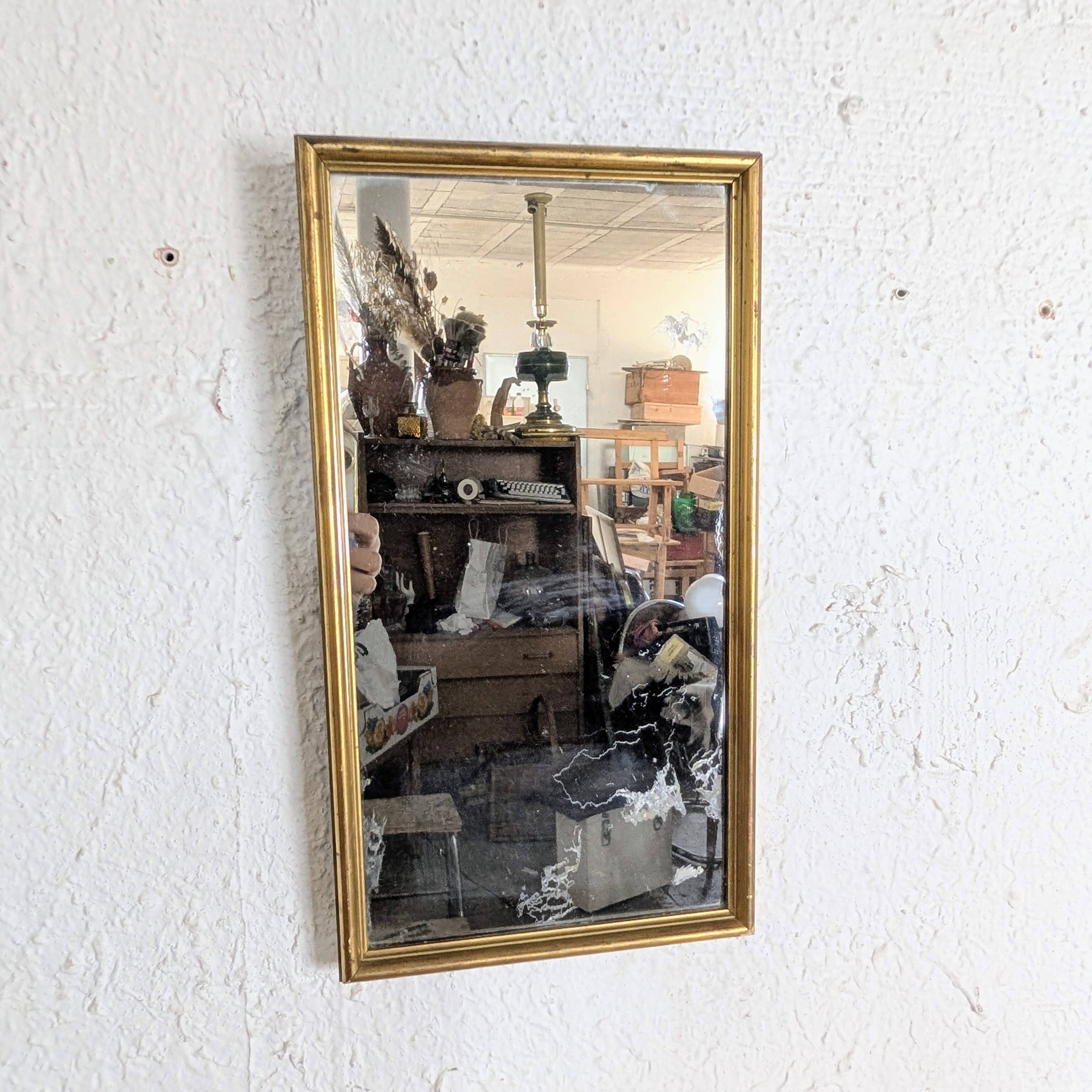 Miroir ancien doré à la feuille glace piquée