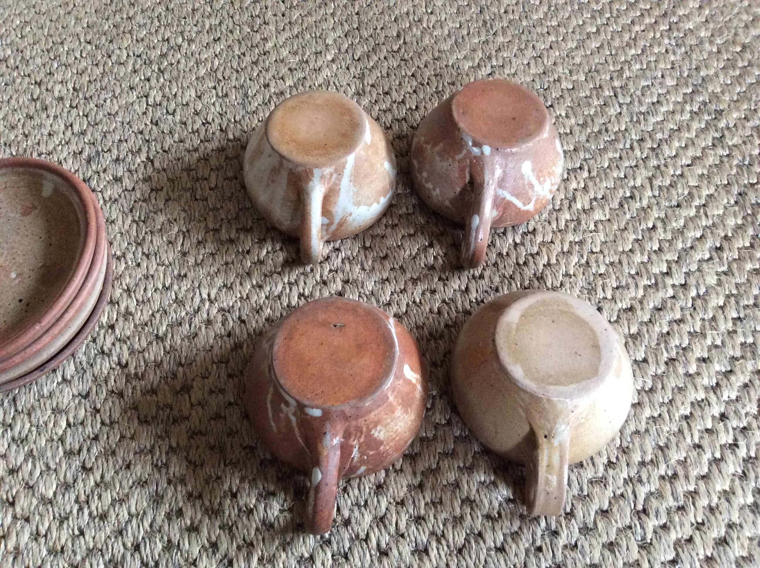 Series of 4 stoneware coffee cups